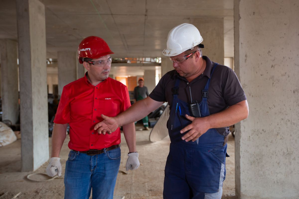 Construction professionals supervising work on site